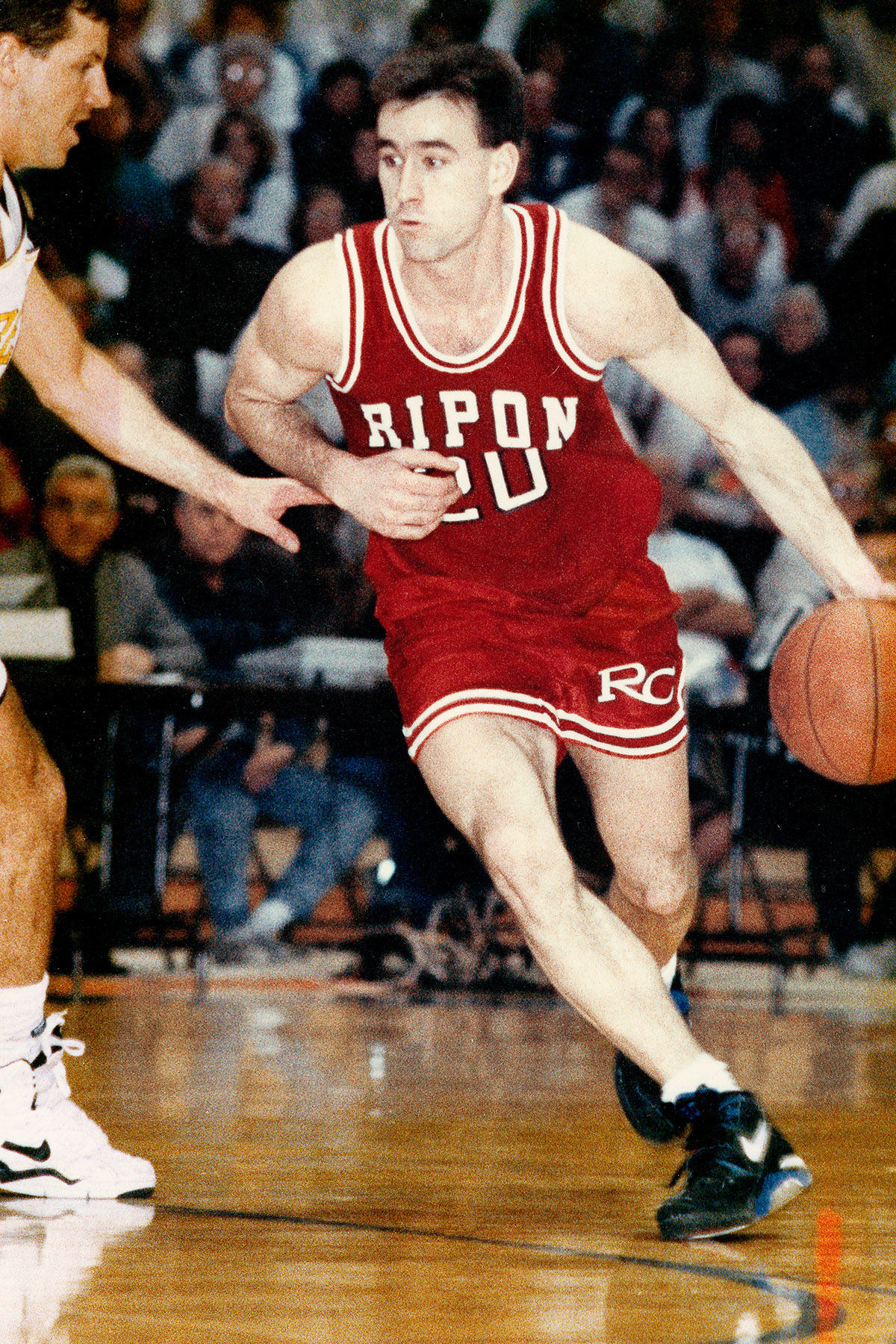 Brad Alberts playing basketball Ripon College