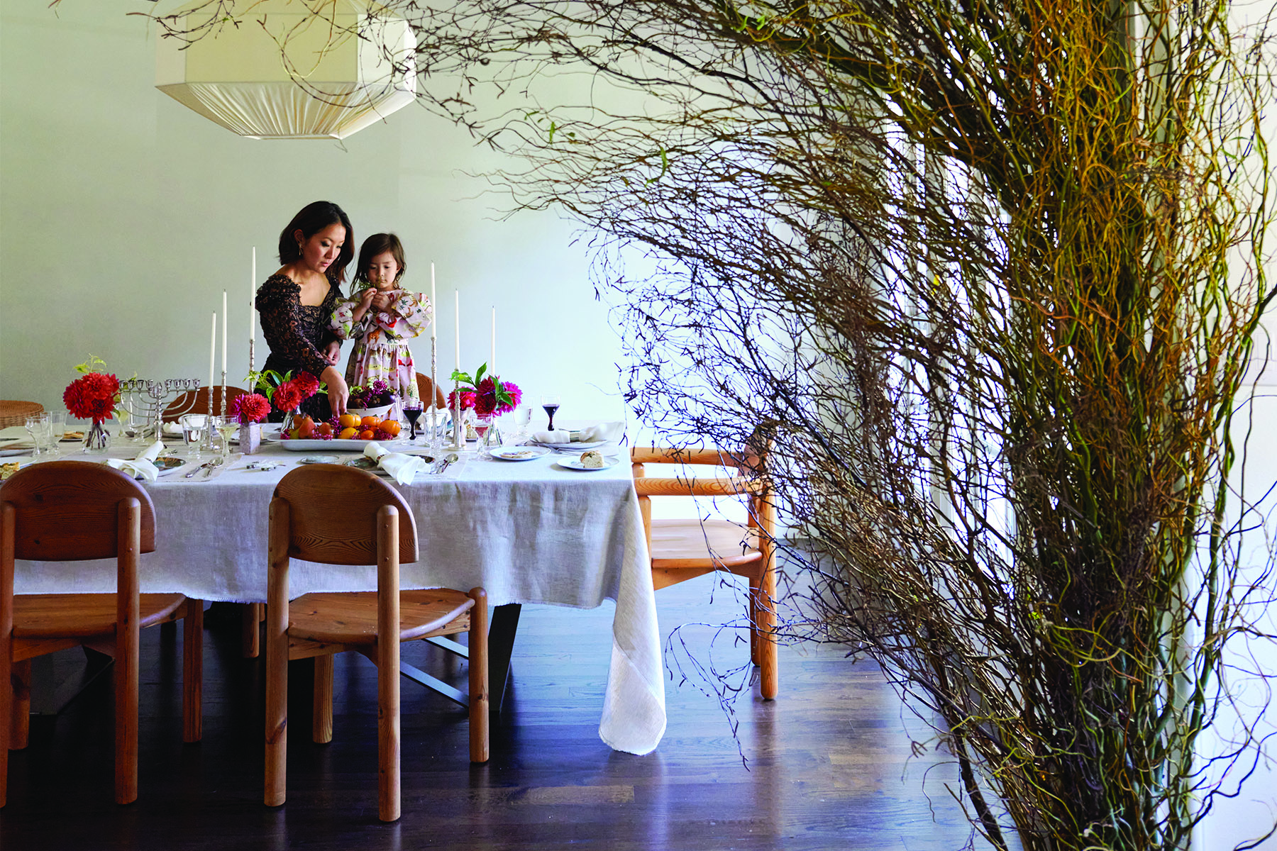 Dining Room table with Ann Wool and daughter, Arel setting up table