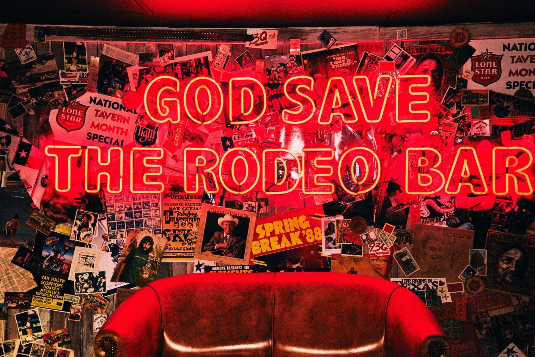 Neon Sign that says “God Save the Rodeo Bar”