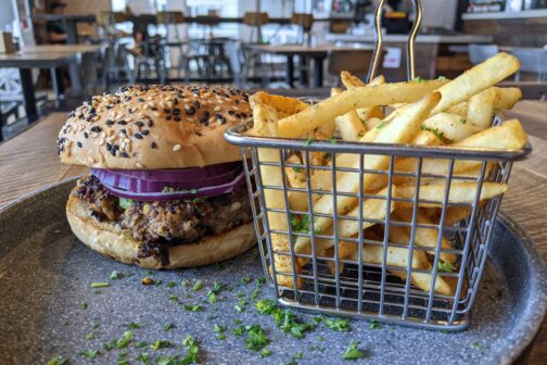 A chapli kebab burger and fries at Adda