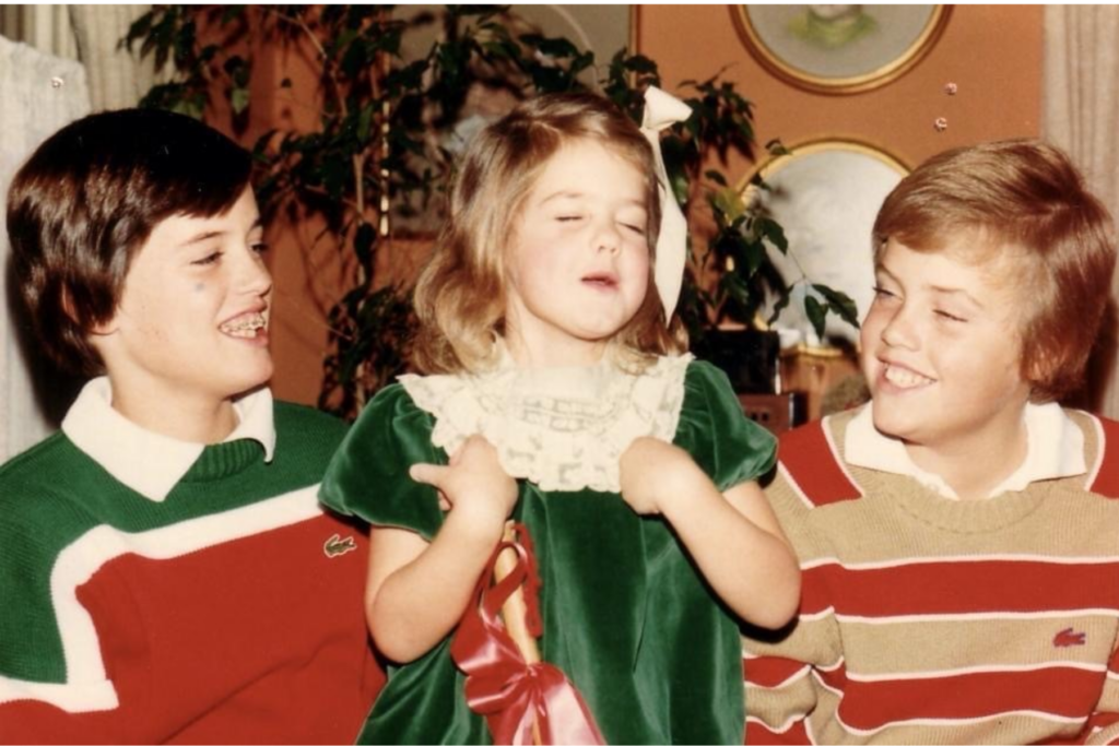 Mimi Crume Sterling (center) celebrates the holidays with her two brothers, Barry (right) and T.J. (left) in 1980.