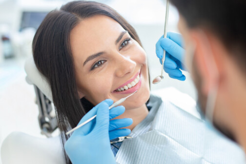 woman smiling at dentist before cleaning