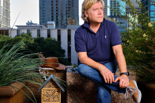 David Burrows on roof of Fairmont Hotel with bee hive