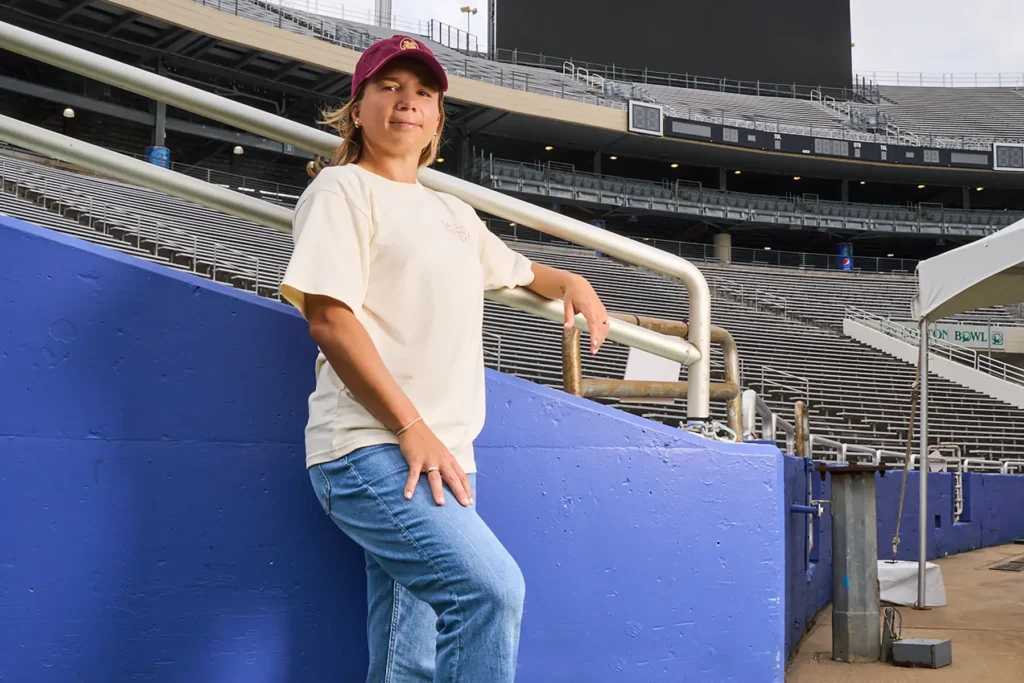 Amber Brooks posing at an empty Cotton Bowl Stadium.