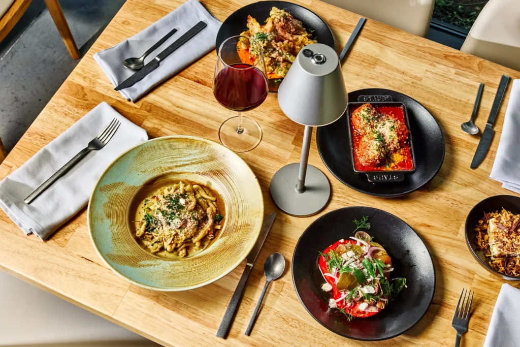 Top down view of a table set for two at the Dallas restaurant, Radici Wood Fire Grill.