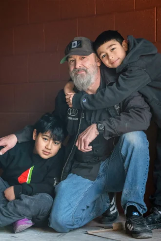 Vaqueros Texas Bar-B-Q Pitmaster Trey Sanchez with his children.