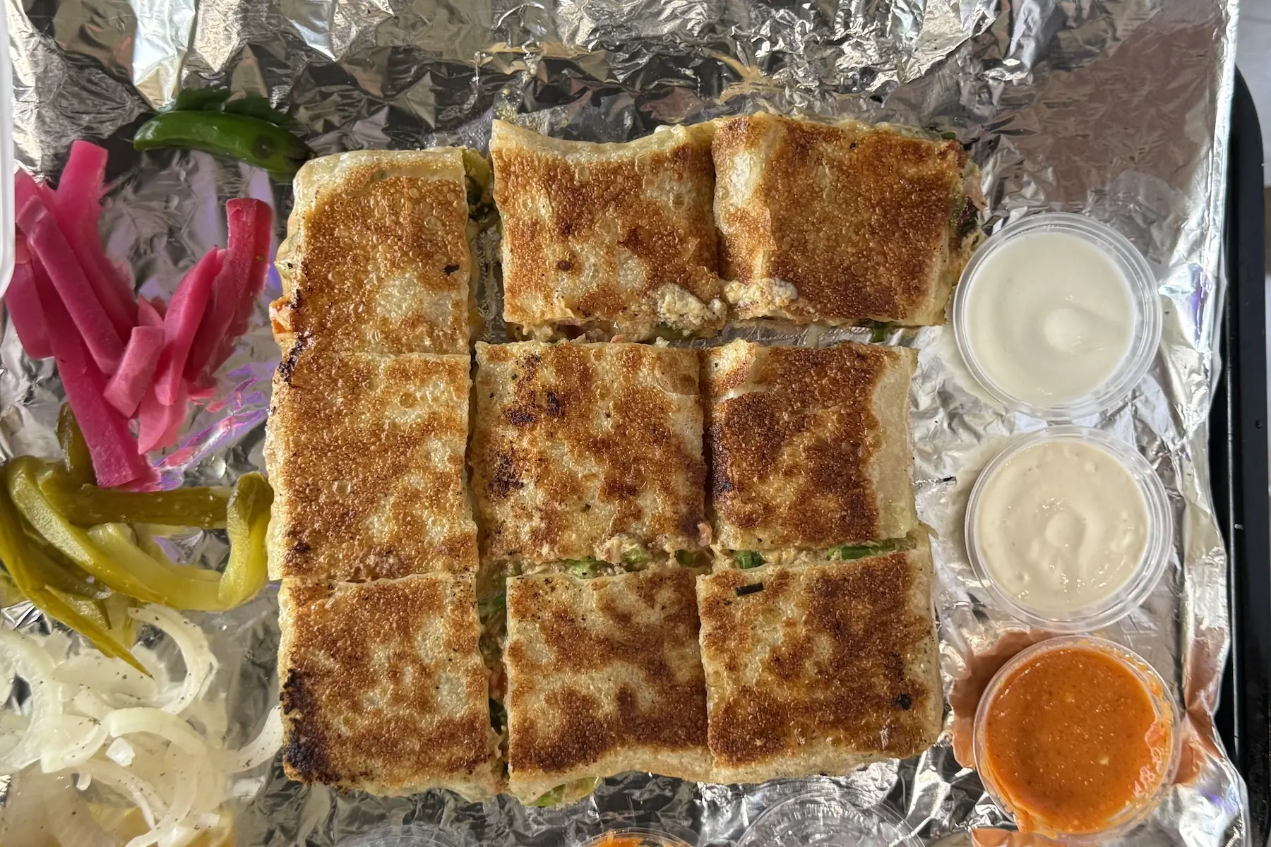 Mutabbaq, Yemeni Flatbread Wraps, Are the Newest Stars of Richardson’s Global Feast — D Magazine
